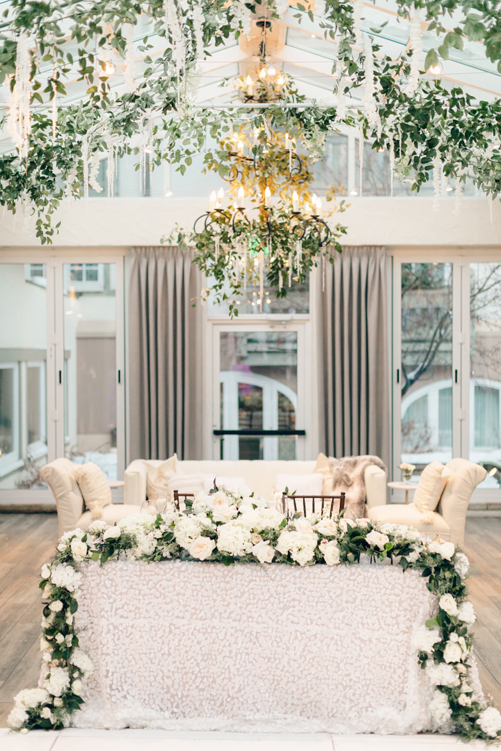wedding installations; wedding chandelier; hanging greenery; floral installation; Colorado wedding John Moler Photography